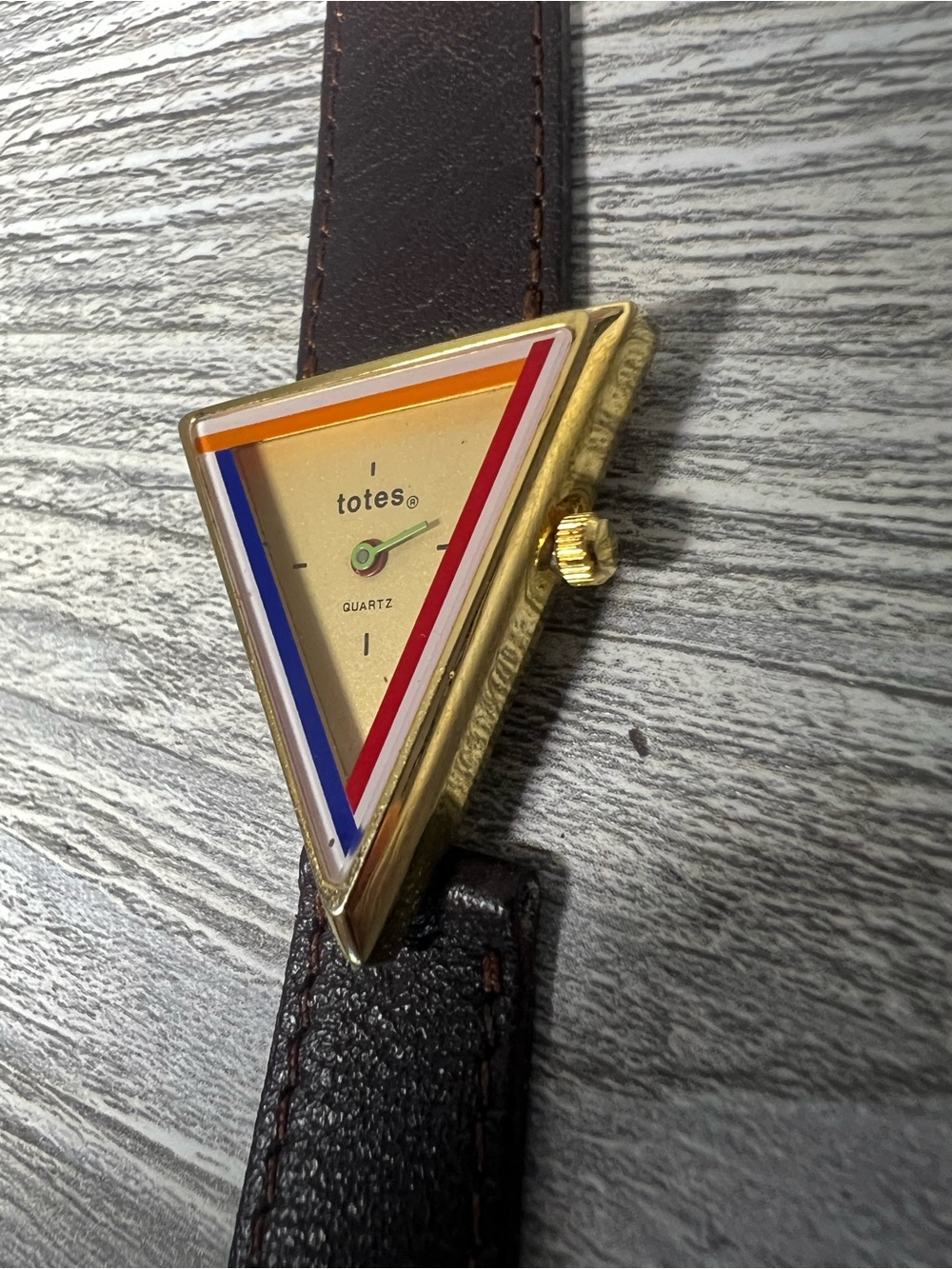 totes Gold-Tone Triangular Watch with Red, Blue, Orange Accents
